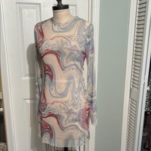 Dippin Daisy’s main character, cover-up, mini dress